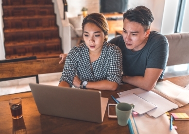 Couple Looking at Laptop